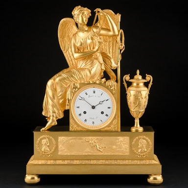 Mythological Empire mantel clock "Iris attaching her wings" signed Thomire